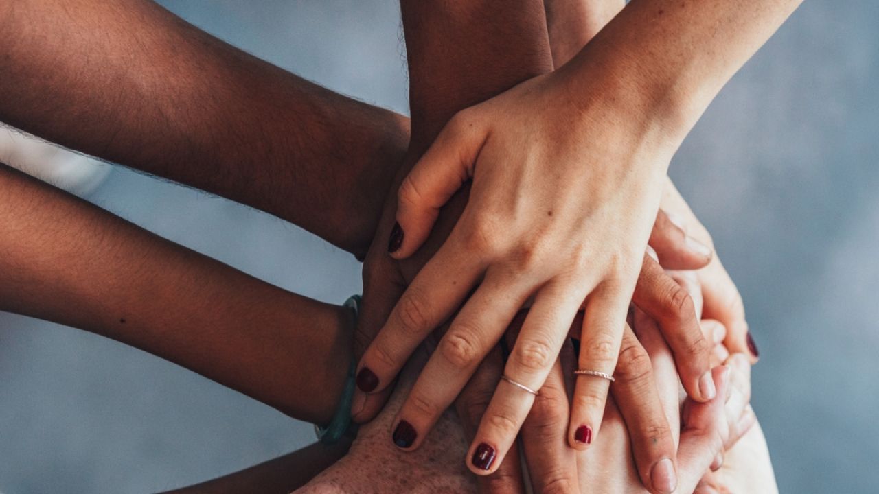 Hands in a pile